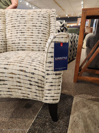 The Superstyle 341 Accent Chair features a beige pattern and espresso legs, perfect for elevating any living space.