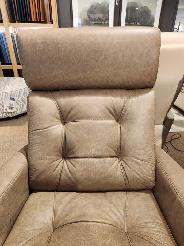 Palliser 43411 Baltic 2 Power Swivel Glider in brown leather with visible stitching and button tufting.