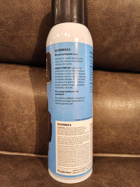 A can of Eric Cox Spray Carpet Cleaner with instructions and details visible on the label.