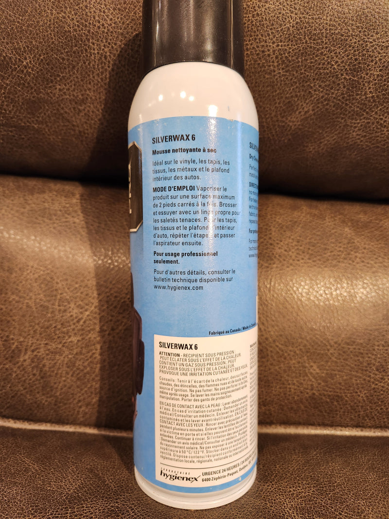 A can of Eric Cox Spray Carpet Cleaner with instructions and details visible on the label.