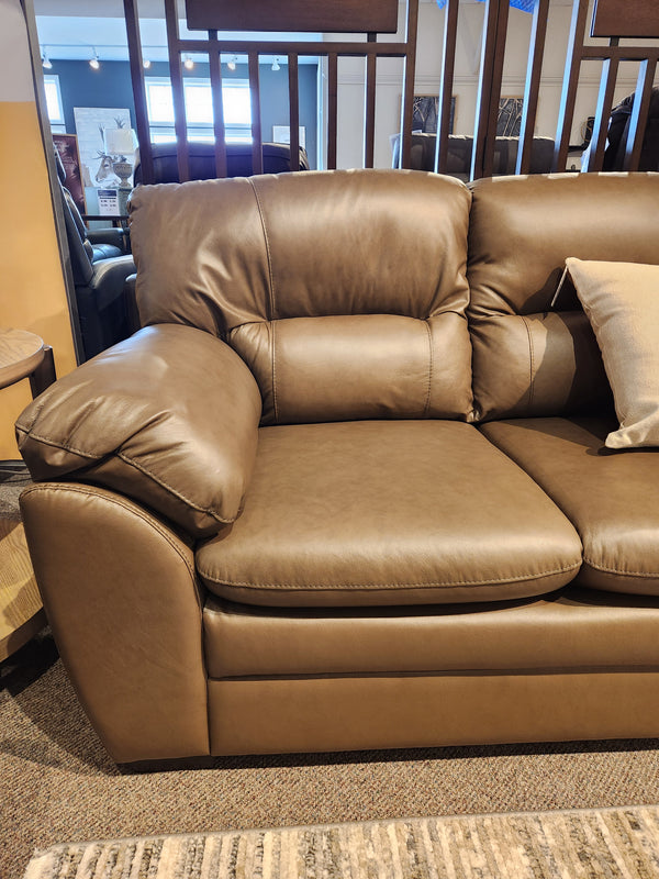 The Palliser 77343 Amisk Sofa features brown leather and plush cushions, perfect for comfortable lounge seating anywhere.