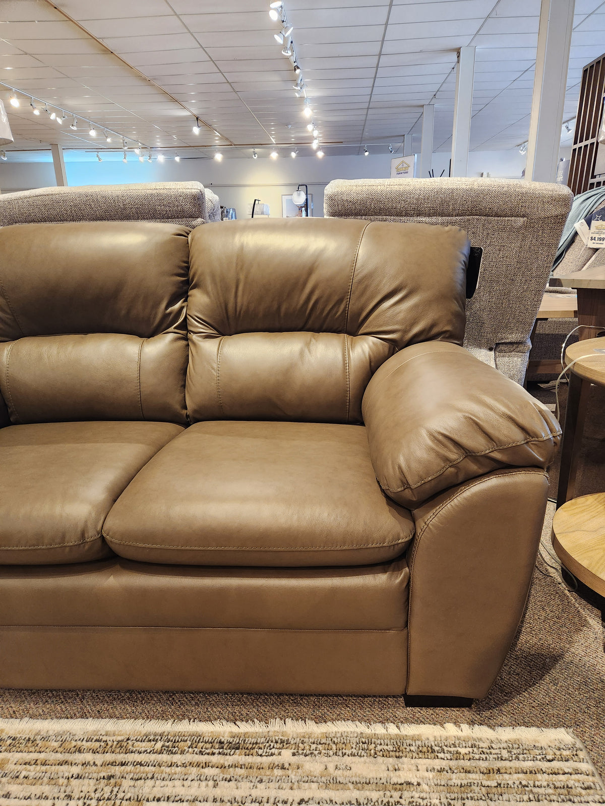 Palliser 77343 Amisk Loveseat in brown leather with high-resiliency foam seat, shown with plush cushions.