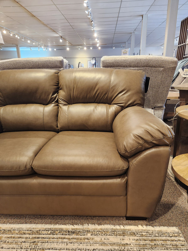 Palliser 77343 Amisk Loveseat in brown leather with high-resiliency foam seat, shown with plush cushions.