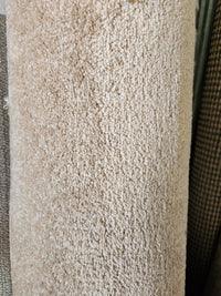 A close-up of Flooring CLEARANCE Carpet Remnant 5'2" X 12', highlighting its soft, textured low pile surface.