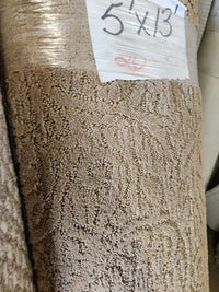 Close-up of Flooring CLEARANCE Carpet Remnant 5' X 13' with a "5 x 13" label on the packaging.
