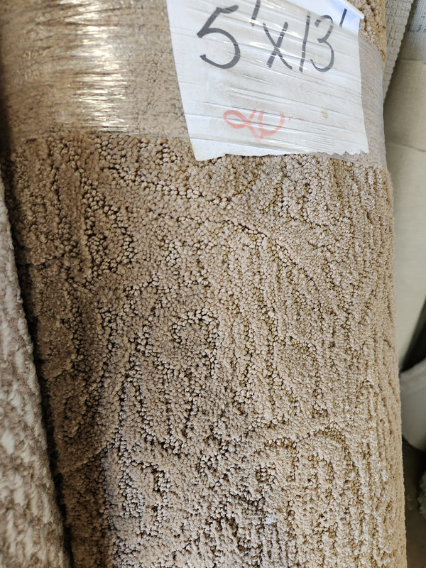 Close-up of Flooring CLEARANCE Carpet Remnant 5' X 13' with a "5 x 13" label on the packaging.