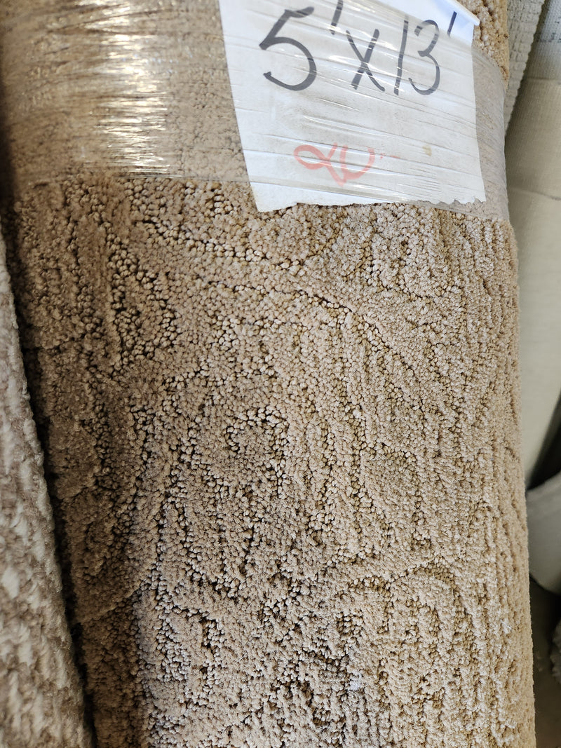 Close-up of Flooring CLEARANCE Carpet Remnant 5' X 13' with a "5 x 13" label on the packaging.