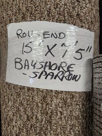 Handwritten label: "Carpet Remnant 15' x 7'5" Flooring CLEARANCE, light beige low loop pile.