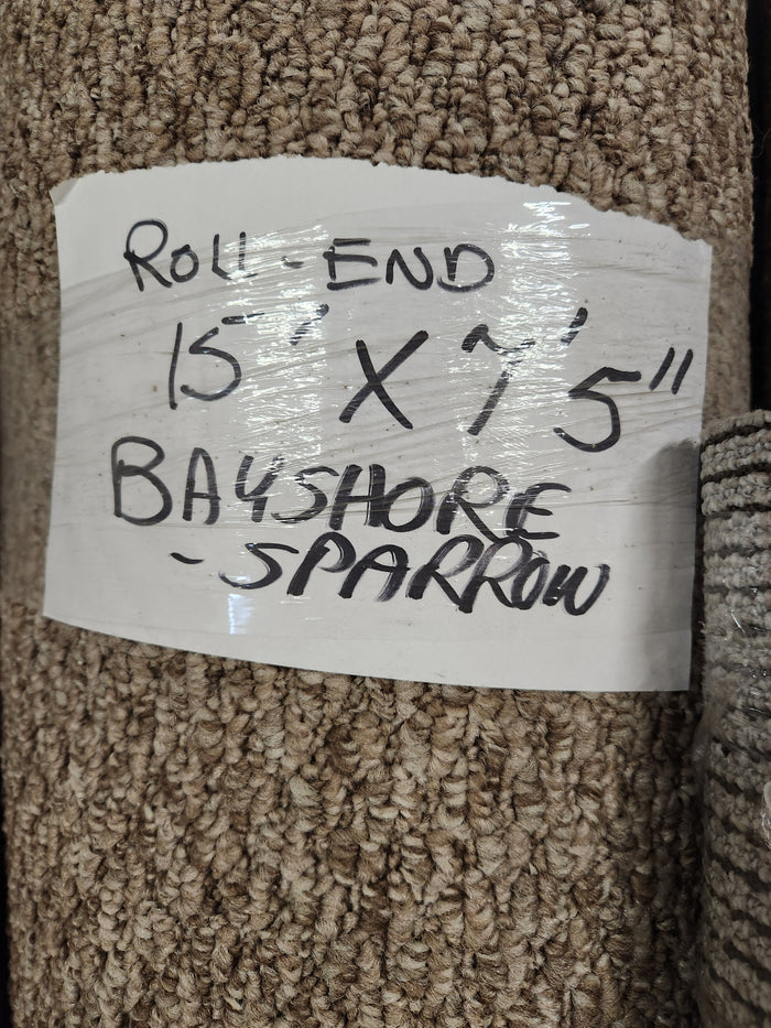 Handwritten label: "Carpet Remnant 15' x 7'5" Flooring CLEARANCE, light beige low loop pile.