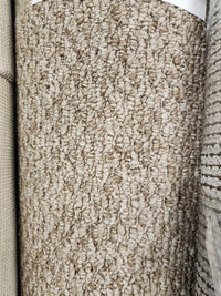 Close-up of Flooring CLEARANCE Carpet Remnant 15' X 7'5", light beige low loop pile, shown among other samples.