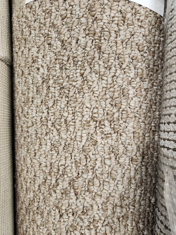 Close-up of Flooring CLEARANCE Carpet Remnant 15' X 7'5", light beige low loop pile, shown among other samples.