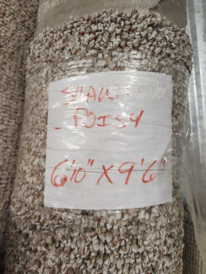 A Flooring CLEARANCE Carpet Remnant 6'10" X 9'6", Low Loop Pile, labeled with red text on white tape. Multi Tan.