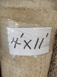 Flooring CLEARANCE Carpet Remnant 4' X 11', beige low pile, rolled and wrapped in plastic.
