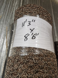 A brown patterned medium pile Carpet Remnant 11'3" x 8'6" by Flooring CLEARANCE, rolled and wrapped in plastic.