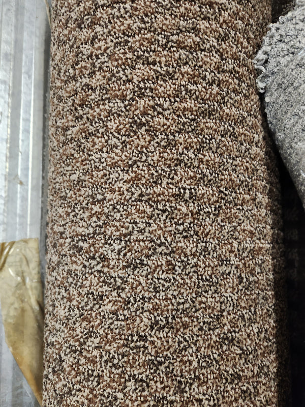 A close-up of Flooring CLEARANCE Carpet Remnant 11'3" X 8'6" medium pile on a metallic surface.