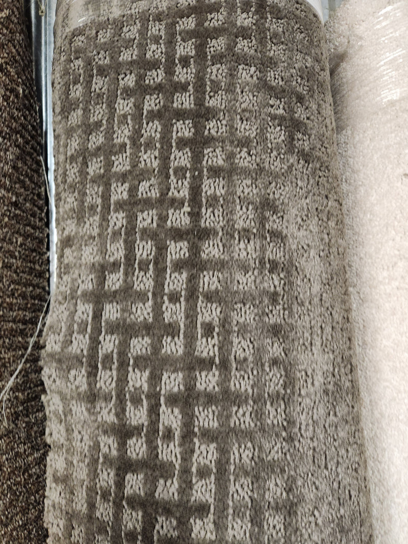 A close-up of Flooring CLEARANCE Carpet Remnant 11'6" x 7'6" with a geometric square pattern, in-store display.