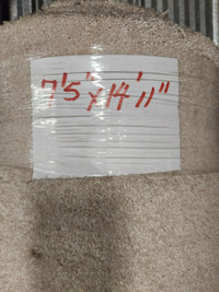 A roll of Flooring CLEARANCE Carpet Remnant 7'5" x 14'11", light beige, medium pile, labeled in red on white tape.