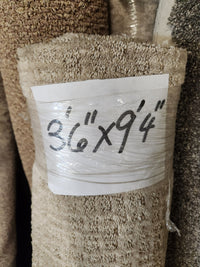 Flooring CLEARANCE Carpet Remnant 8'6" x 9'4", tan pattern beige, low pile, wrapped in plastic.
