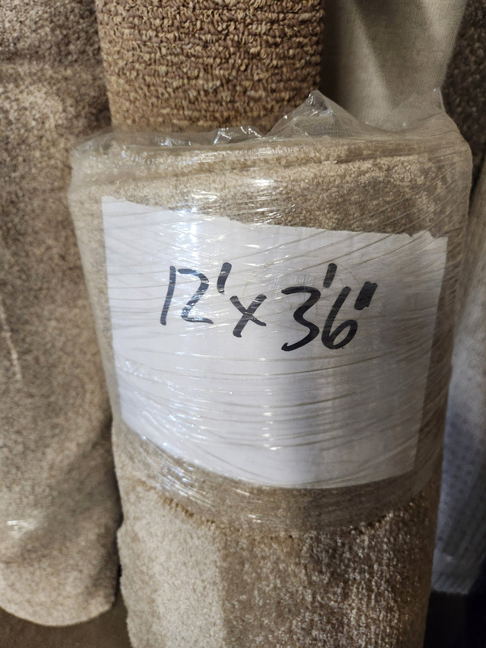 A Flooring CLEARANCE Carpet Remnant 12' x 3'6" roll wrapped in plastic.