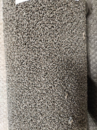 Close-up of Flooring CLEARANCE Carpet Remnant 5'9" x 7'9" featuring textured gray, tightly looped medium pile.