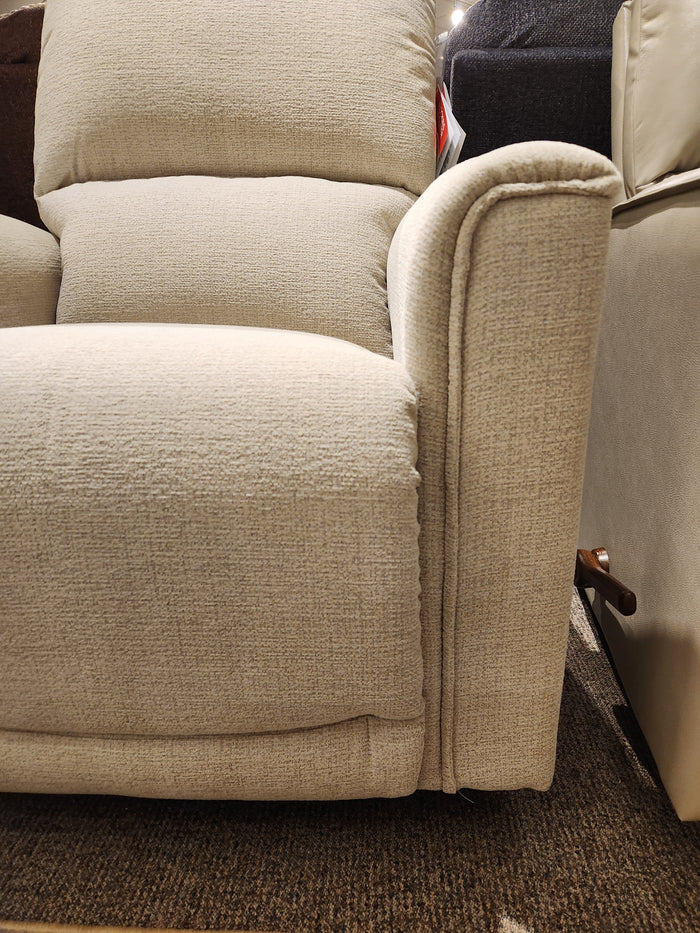 The La-Z-Boy 803 Cade Rocker Recliner is a beige upholstered chair with a visible lever, seen on a brown carpet.