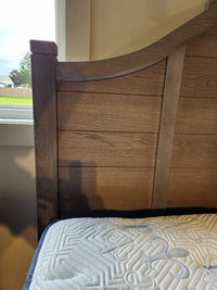 The 740 Bungalow Arch King Bed by Vaughan Bassett features an arched North American hardwood headboard by a window.