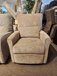 The Palliser Pinecrest Rocker Recliner features a beige upholstered finish with rolled arms and a supportive high back.