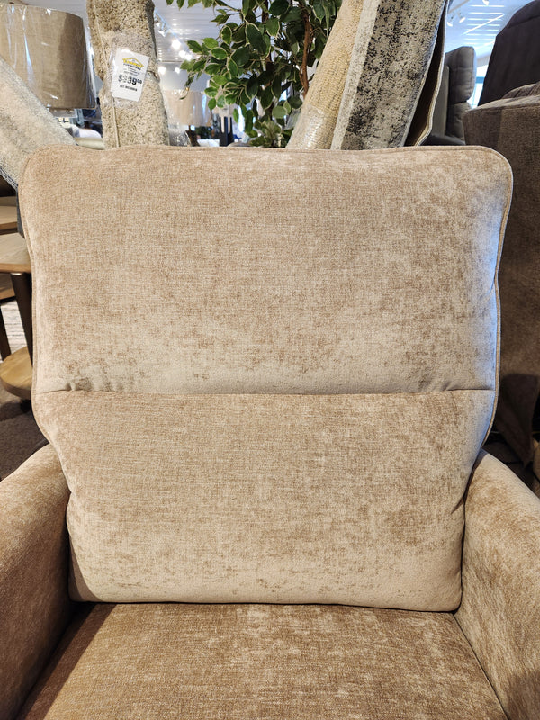 Close-up of the Palliser Pinecrest Rocker Recliner, featuring beige upholstery and plush cushions in a furniture store.