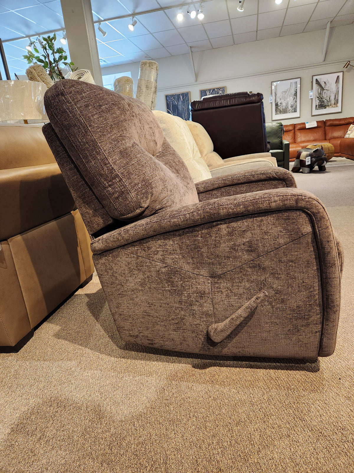 The Palliser 40034 Torrington WallHugger Recliner, in brown with padded track arms, suits any modern living space.