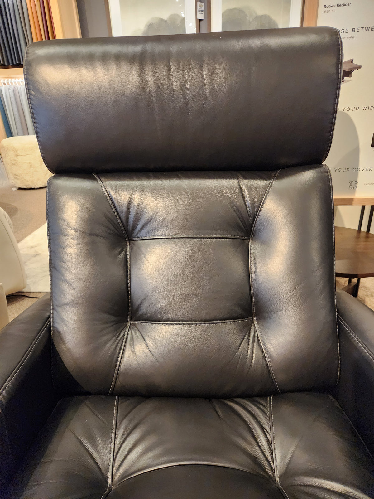 Palliser 43411 Baltic 2 Power Swivel Glider in black leather with visible stitching and high cushioned backrest.