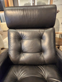 Palliser 43411 Baltic 2 Power Swivel Glider in black leather with visible stitching and high cushioned backrest.