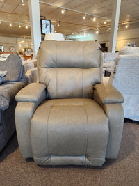 The Best Maverly 9NP14 Space Saver Recliner in tan with padded armrests and comfort dial, shown among other chairs.