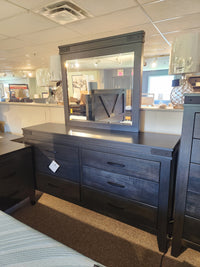 Handstone Chattanooga 6 Drawer Dresser features custom metal hardware and a large mirror in a dark wood finish.