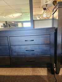 The Handstone Chattanooga 6 Drawer Dresser, dark wood with metal hardware, is shown with a price sign above.