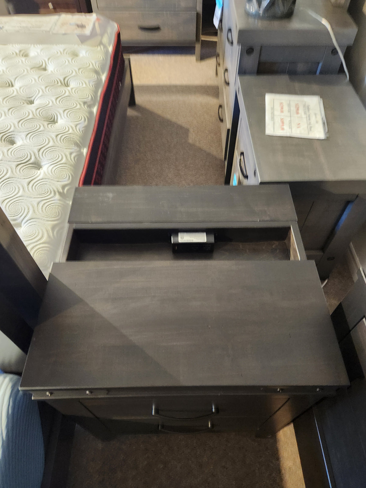 The Handstone Chattanooga Power Nightstand with custom metal hardware sits beside the bed.
