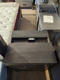 The Handstone Chattanooga Power Nightstand with custom metal hardware sits beside the bed.