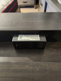 Close-up of built-in outlet in the Handstone Chattanooga Power Nightstand in Heritage Maple Charcoal finish.