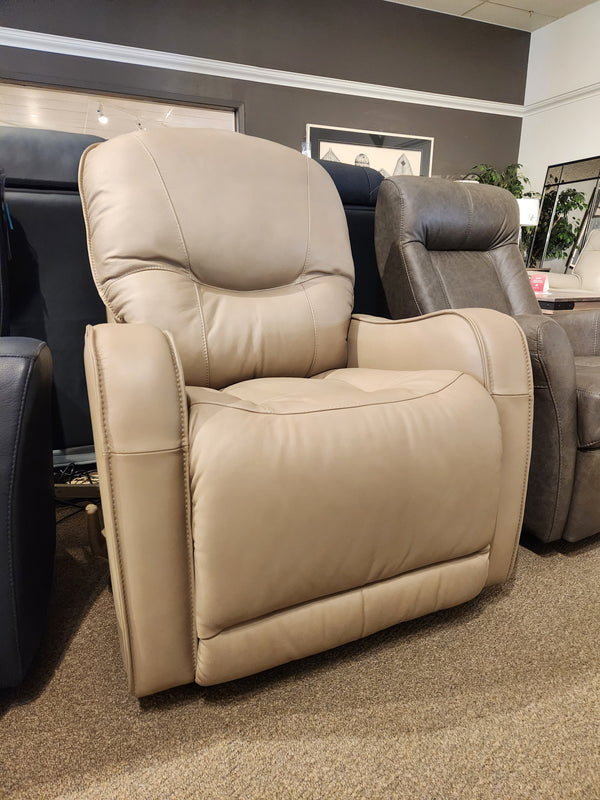 The Palliser 43012 Yates Rocker Recliner in beige real leather is showcased among other recliners in the showroom.