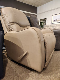 Palliser 43012 Yates Rocker Recliner in beige leather with high-density foam, shown in a furniture showroom.