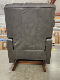A La-Z-Boy 528 Larson All Leather Power Rocker Recliner with chaise seat, viewed from behind on a concrete floor.
