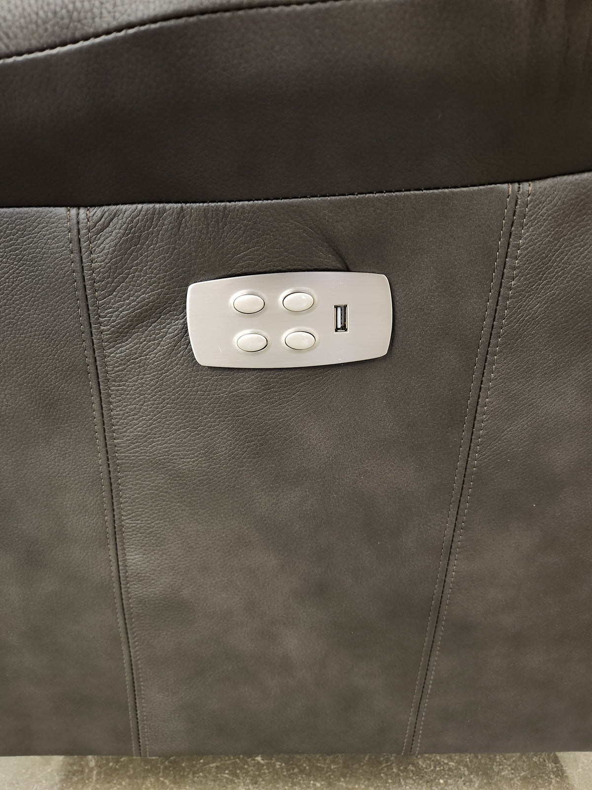 Close-up of La-Z-Boy 528 Larson All Leather Power Rocker Recliner control panel with four buttons and USB port.