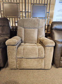 A Golden Venice PL447 Power Lift Chair on display among similar chairs in a furniture store.