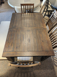 The Jofran Willow Creek 5 Piece Dining Table Set features a pine table, bench, and three wooden chairs.