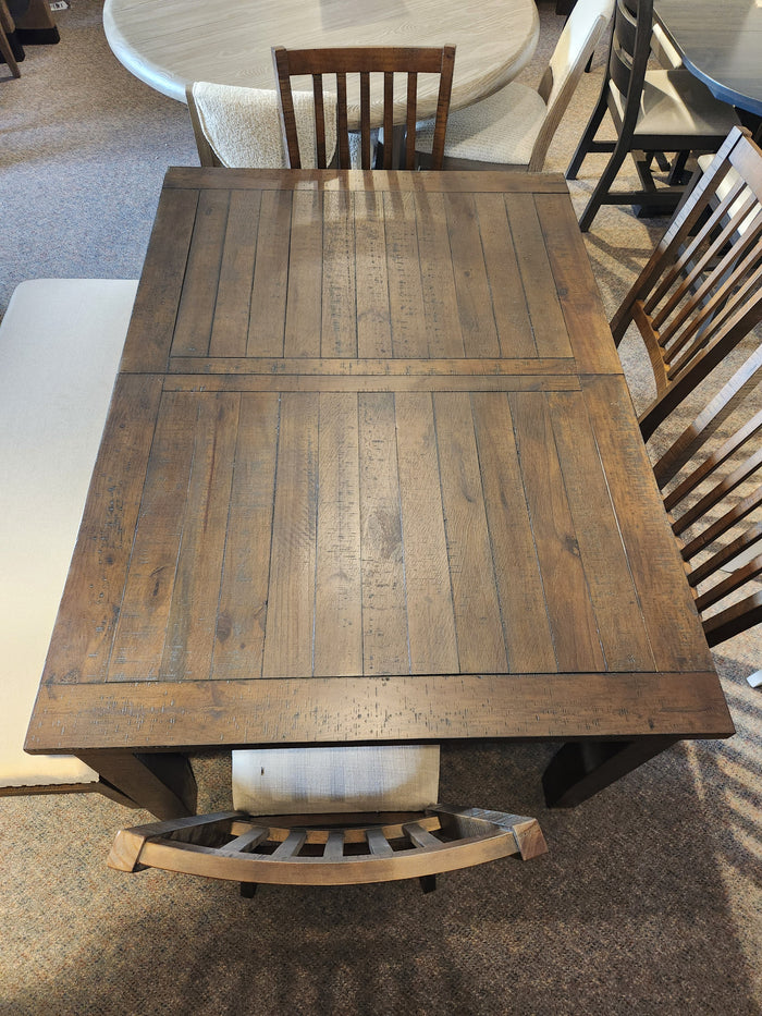 The Jofran Willow Creek 5 Piece Dining Table Set features a pine table, bench, and three wooden chairs.