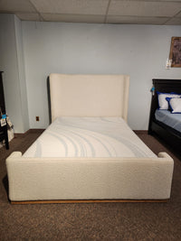 The Fashion Nala Bed features a cream boucle platform design with a high wingback headboard, shown without bedding.