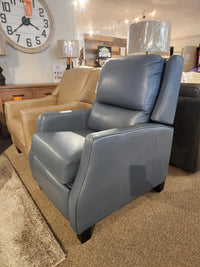 Leather Craft 625 Reclining Chair in blue Canadian leather on display among other leather furniture in the showroom.
