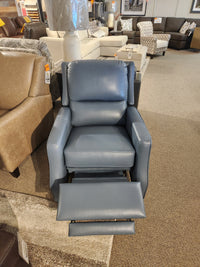 The Leather Craft 625 Reclining Chair in blue leather with extended footrest is displayed in a furniture showroom.
