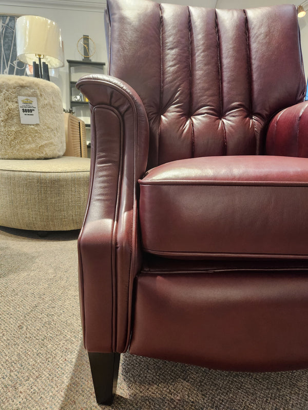 Close-up of a maroon Leather Craft 686 Reclining Chair on carpet, with another chair and lamp in the background.