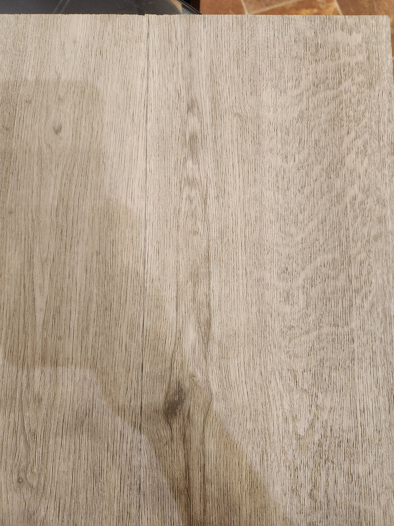 Close-up of light wood tabletop with grain, resembling Beckham Brothers Posh Plank LVP - Middlesex.