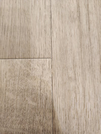 Close-up of Beckham Brothers Posh Plank LVP (Middlesex): waterproof planks with grain and slight gaps between panels.